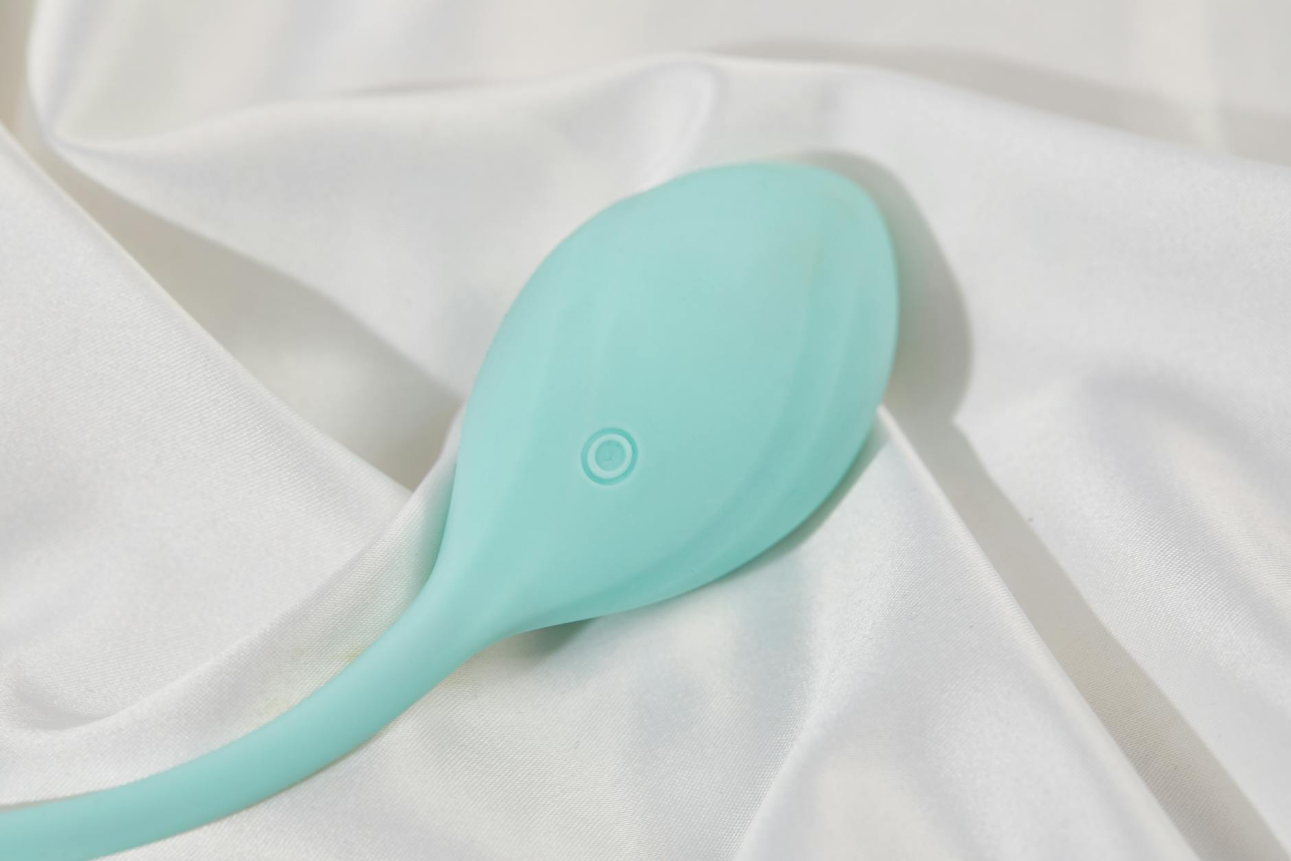 A couple standing together holding a blue vibrator, symbolizing shared intimacy and connection.
